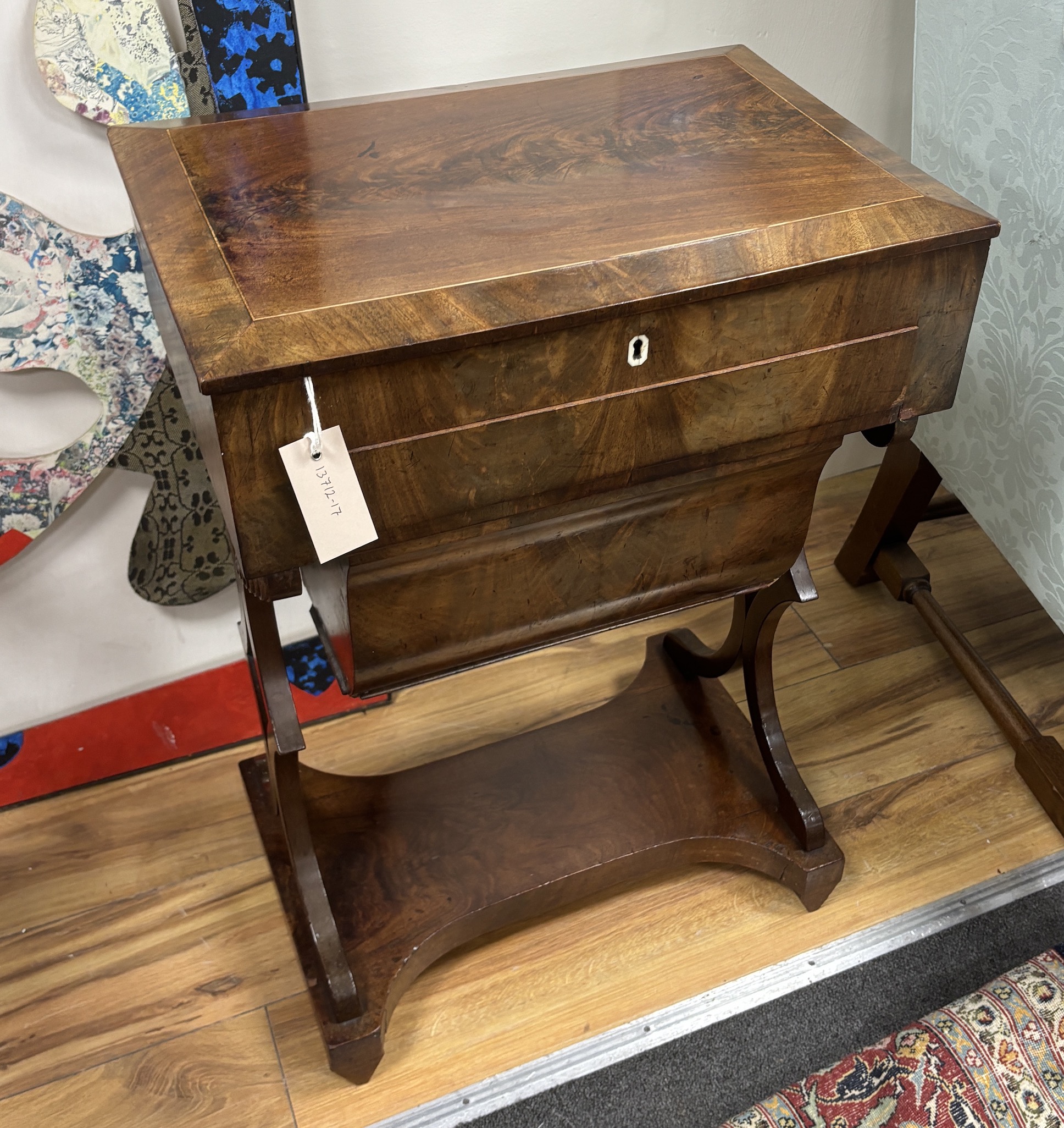An early 19th century Dutch rectangular mahogany sewing table, width 49cm, depth 34cm, height 72cm